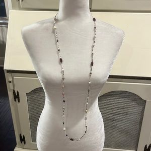 Listing #7709 cream/black/brown/pink beaded necklace. Worn several times.